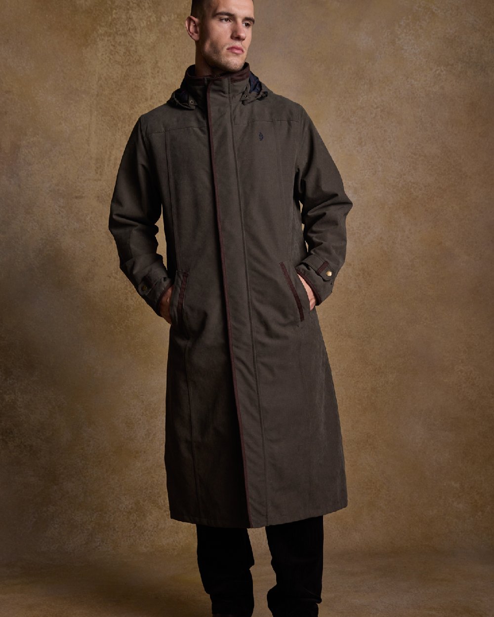 Olive Coloured Jack Murphy Emmet Waterproof Long Coat on indoor background