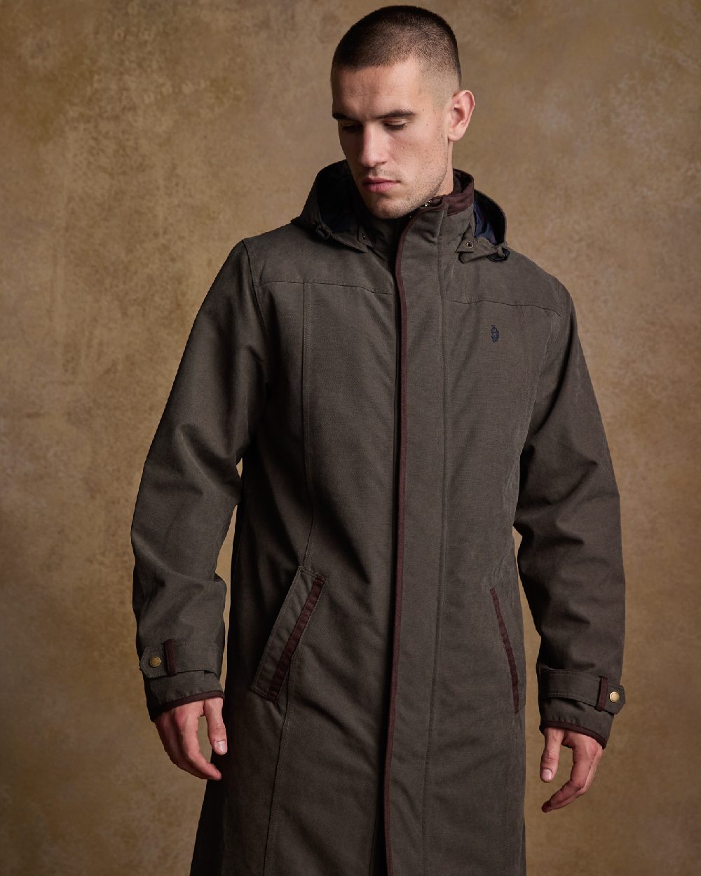 Olive Coloured Jack Murphy Emmet Waterproof Long Coat on indoor background