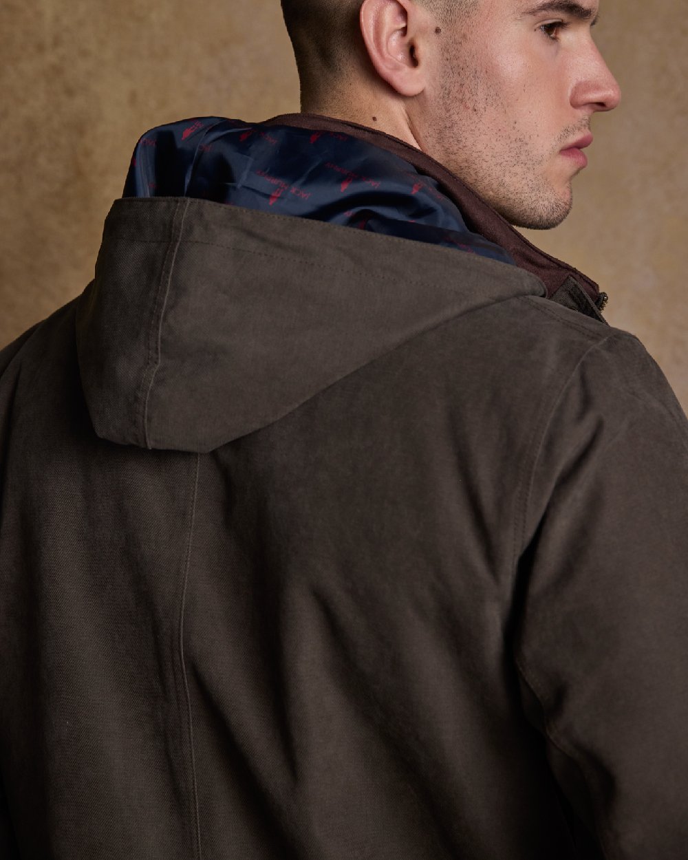 Olive Coloured Jack Murphy Emmet Waterproof Long Coat on indoor background