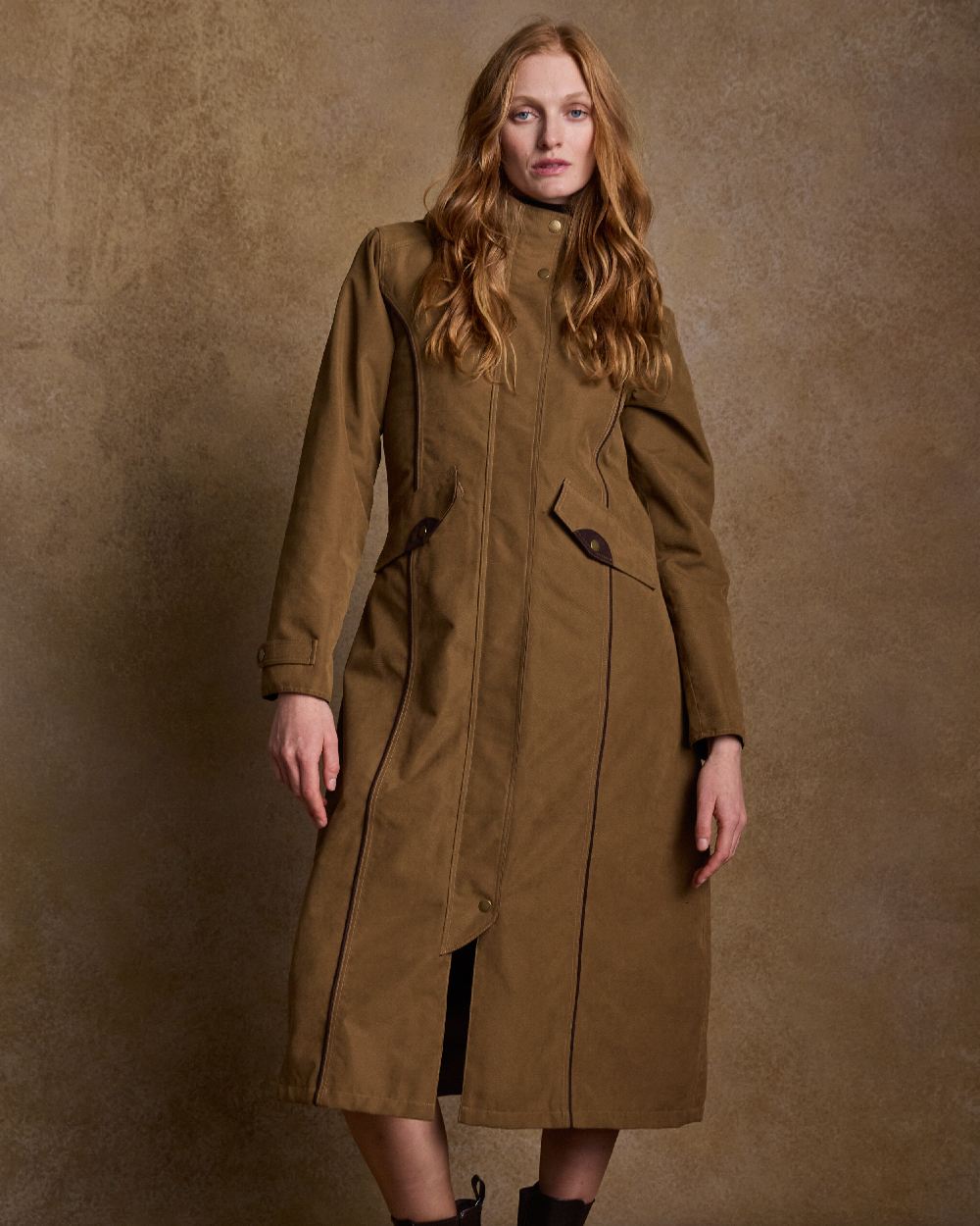 Camel Coloured Jack Murphy Erin Long Waterproof Coat on indoor background