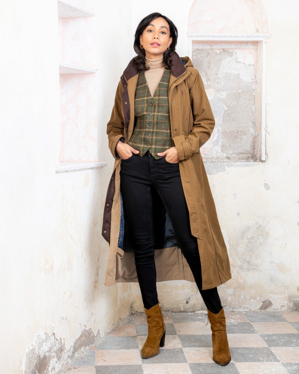 Camel coloured Jack Murphy Erin Long Waterproof Coat on wall background