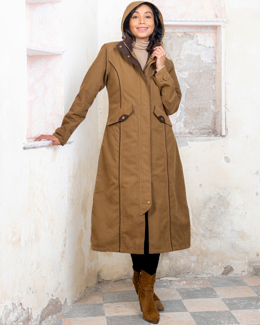 Camel coloured Jack Murphy Erin Long Waterproof Coat on wall background