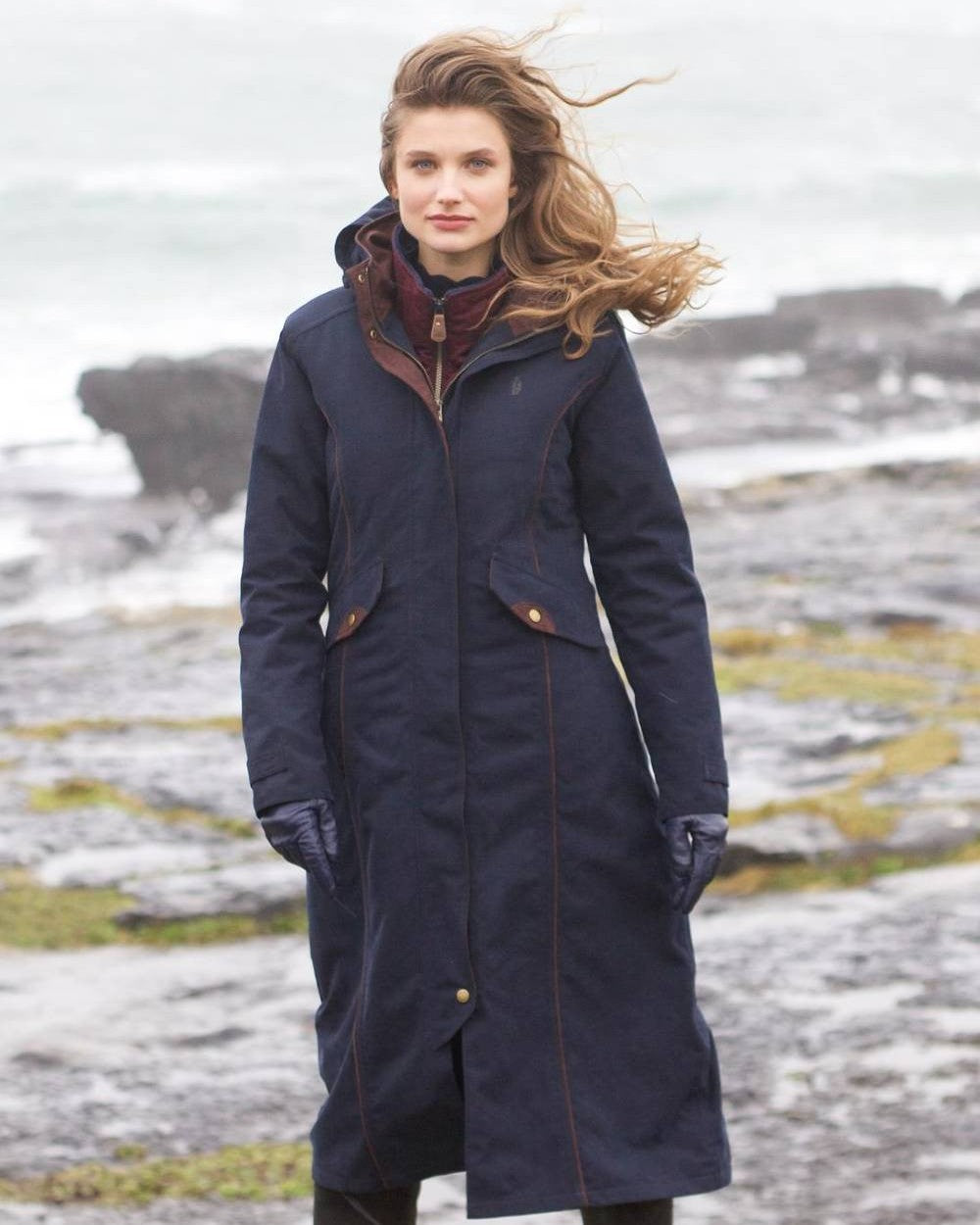 Heritage Navy coloured Jack Murphy Erin Long Waterproof Coat on sea background