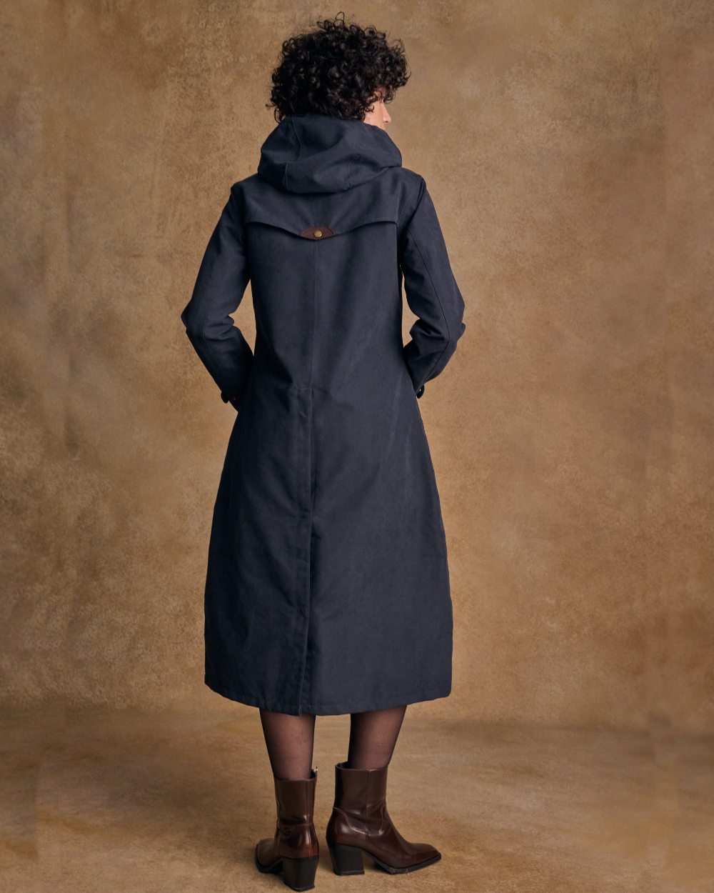 Heritage Navy coloured Jack Murphy Erin Long Waterproof Coat on wall background