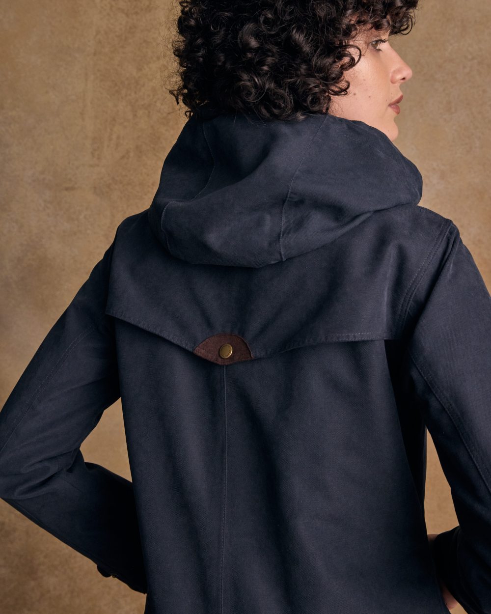 Heritage Navy coloured Jack Murphy Erin Long Waterproof Coat on wall background