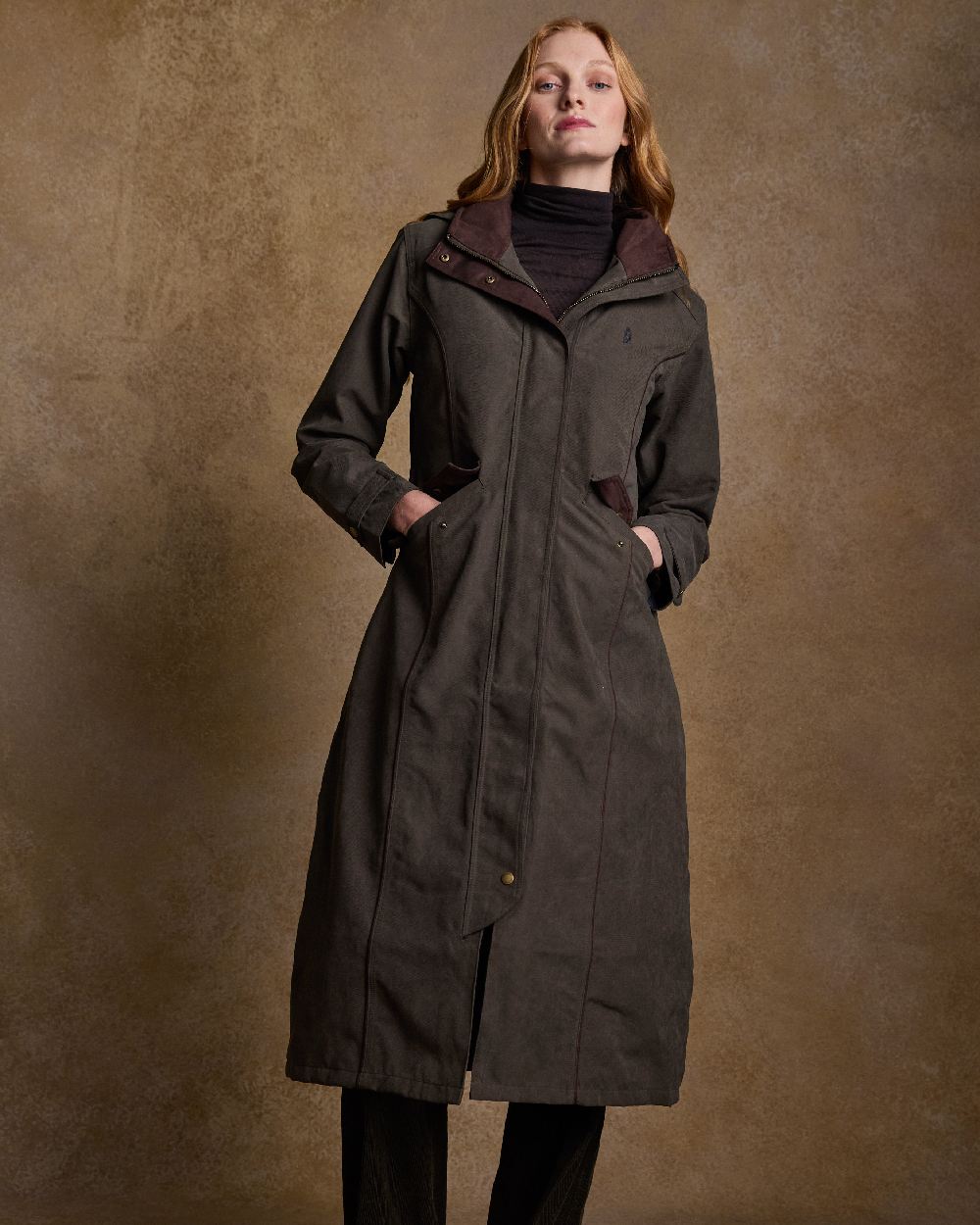 Olive Coloured Jack Murphy Erin Long Waterproof Coat on indoor background