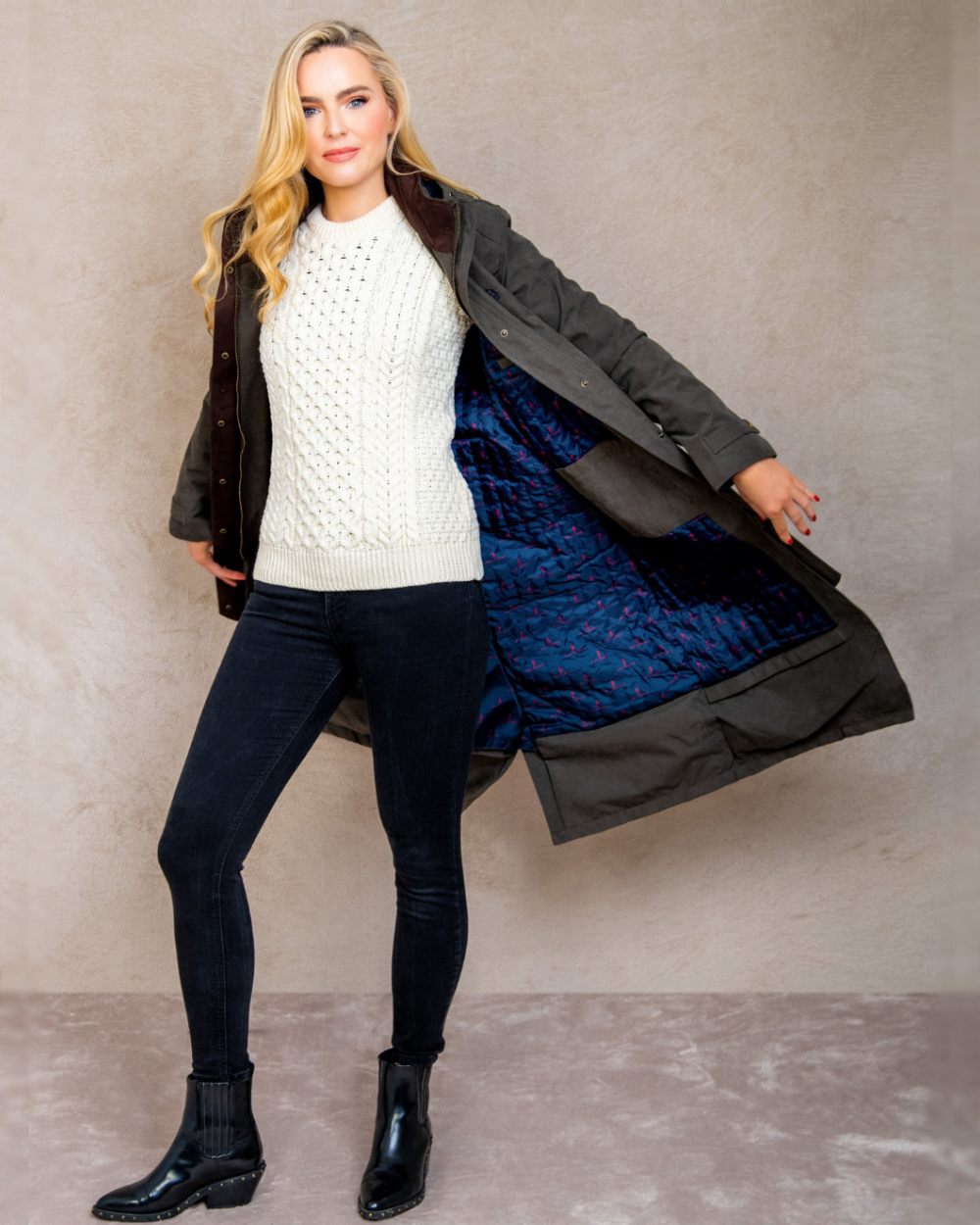 Olive coloured Jack Murphy Erin Long Waterproof Coat on wall background