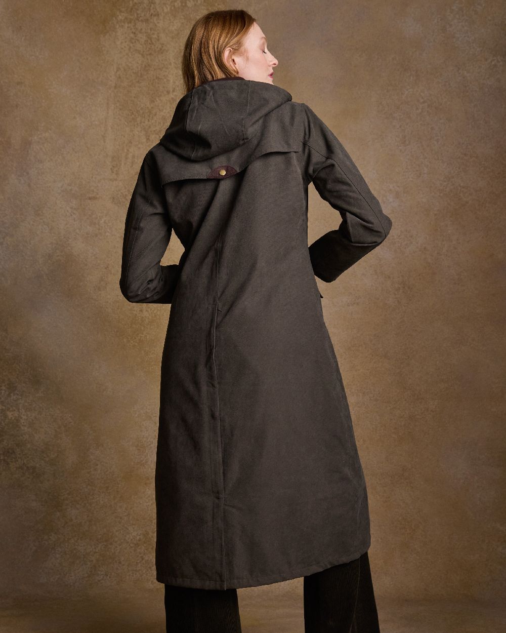 Olive Coloured Jack Murphy Erin Long Waterproof Coat on indoor background