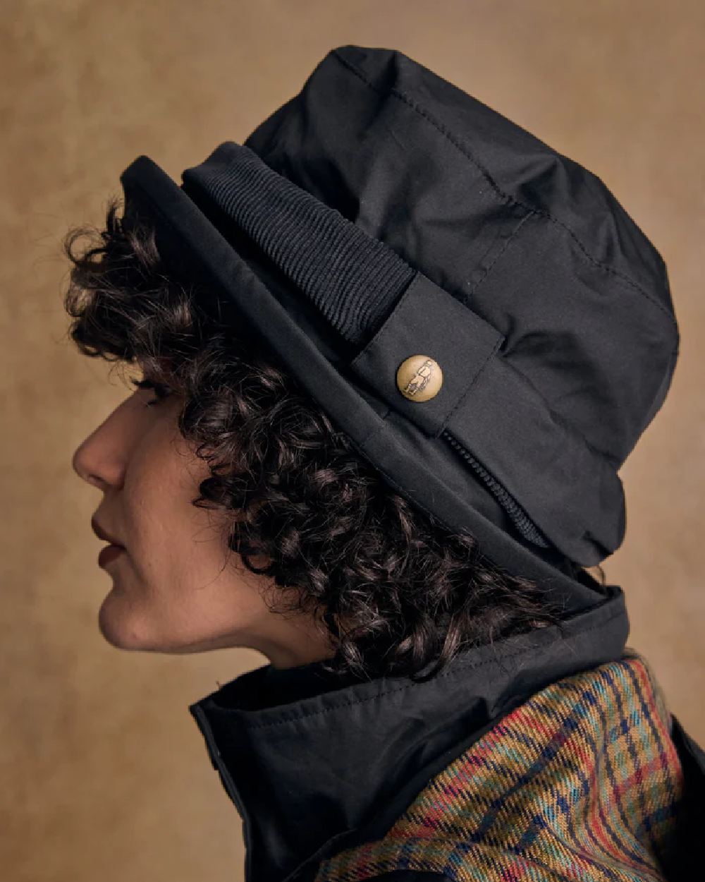 Black coloured Jack Murphy Malvern Heritage Rain Hat on wall background