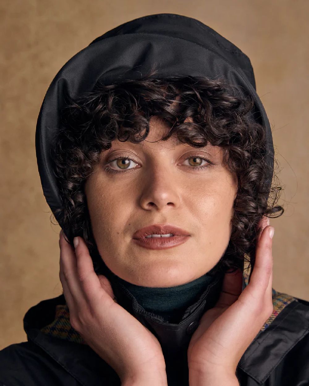 Black coloured Jack Murphy Malvern Heritage Rain Hat on wall background