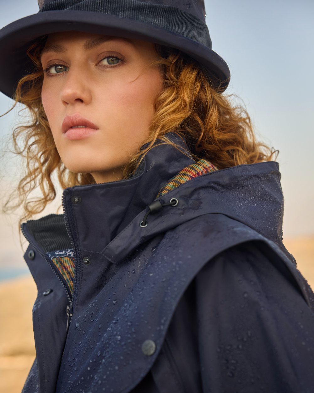 Heritage Navy coloured Jack Murphy Malvern Heritage Rain Hat on outdoor background