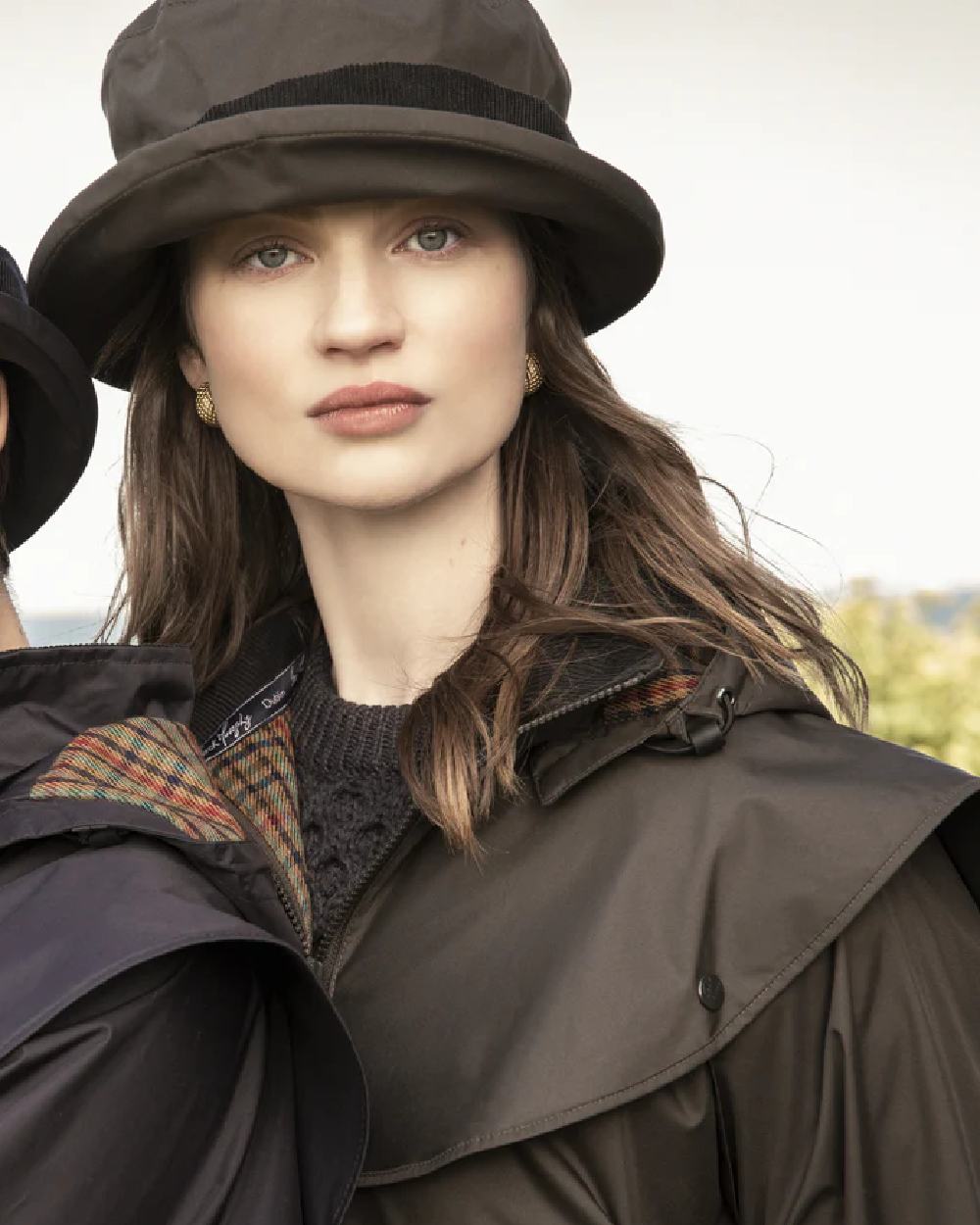 Olive coloured Jack Murphy Malvern Heritage Rain Hat on sky background