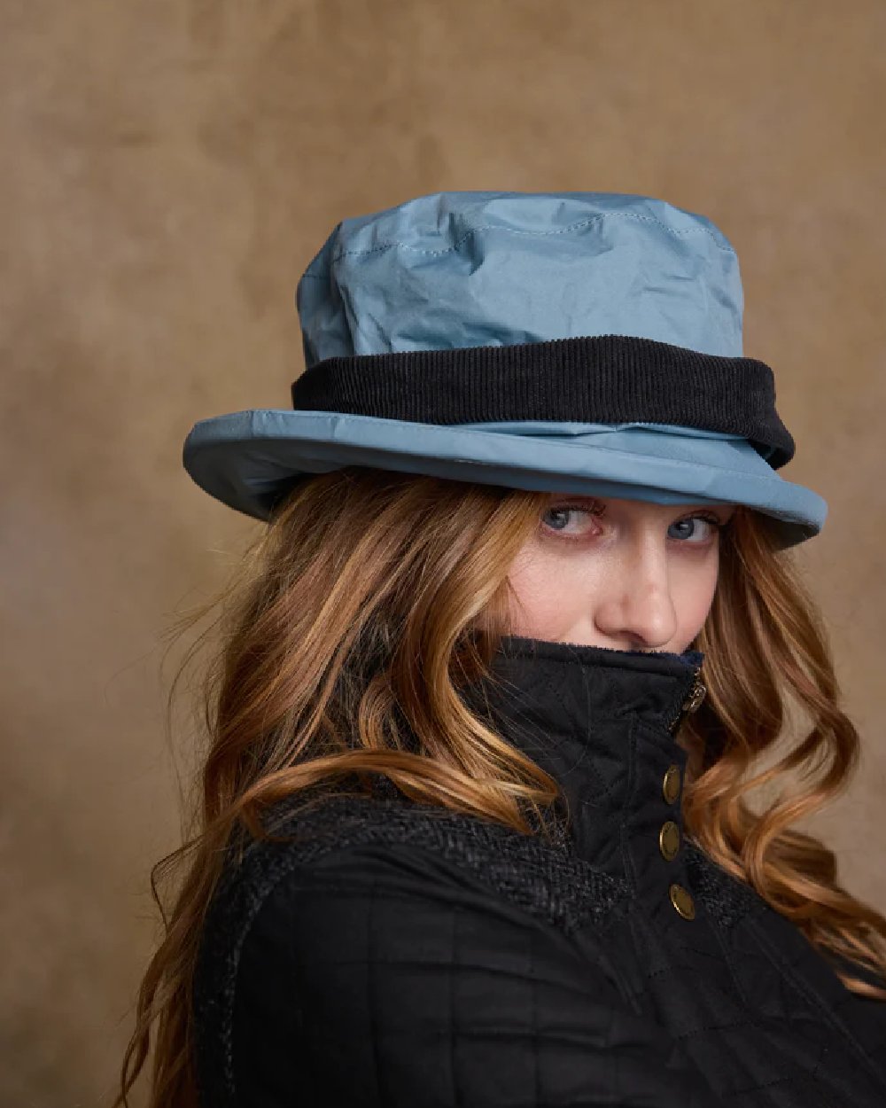 Smoke Blue coloured Jack Murphy Malvern Heritage Rain Hat on wall background