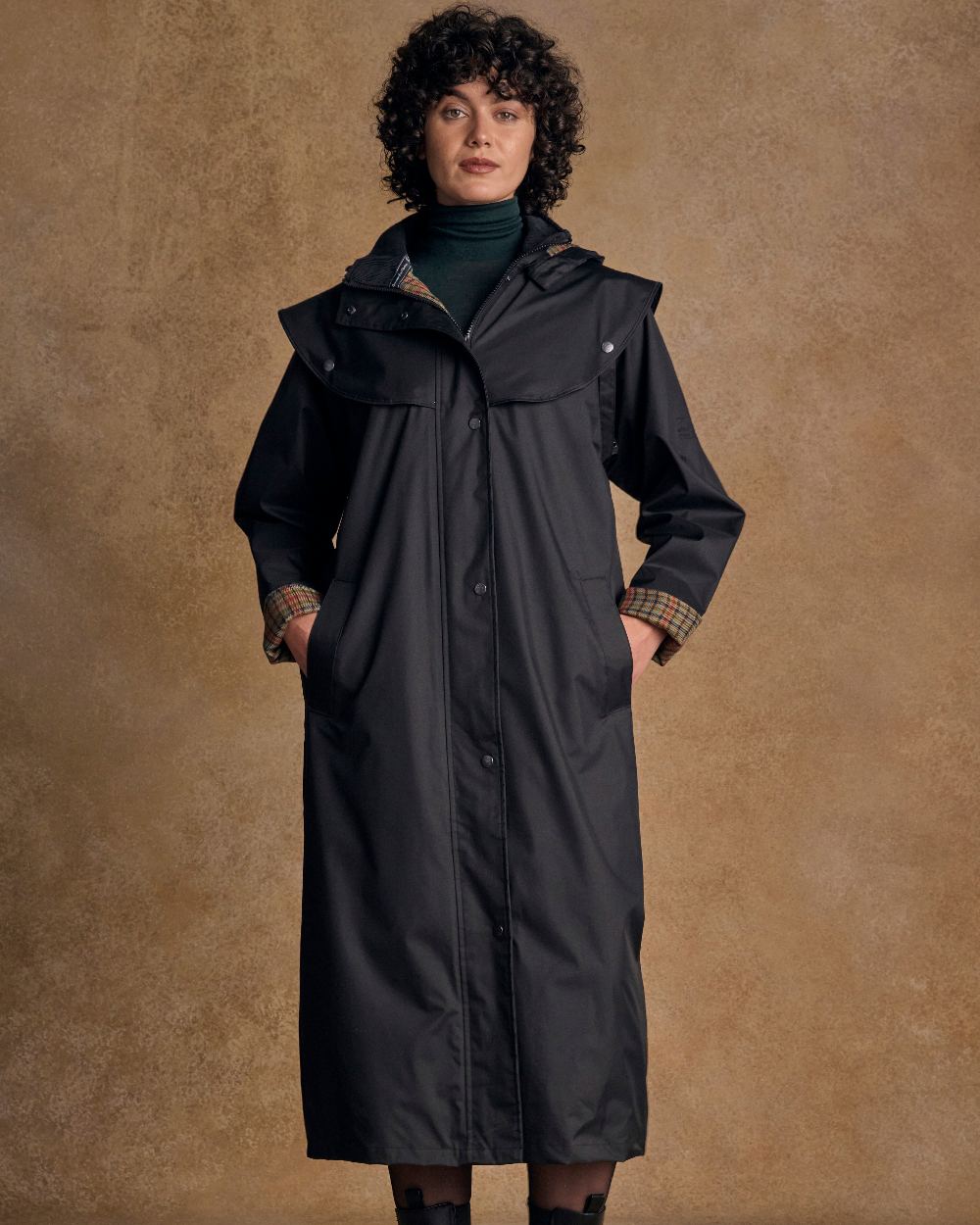Black Coloured Jack Murphy Malvern Ladies Waterproof Bush Coat on indoor background