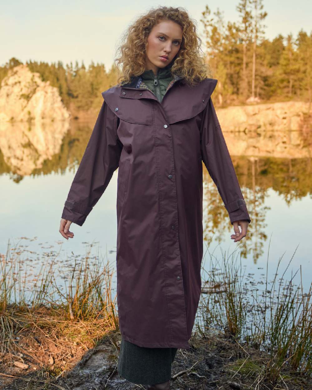 Deep Claret Coloured Jack Murphy Malvern Ladies Waterproof Bush Coat on outdoor background