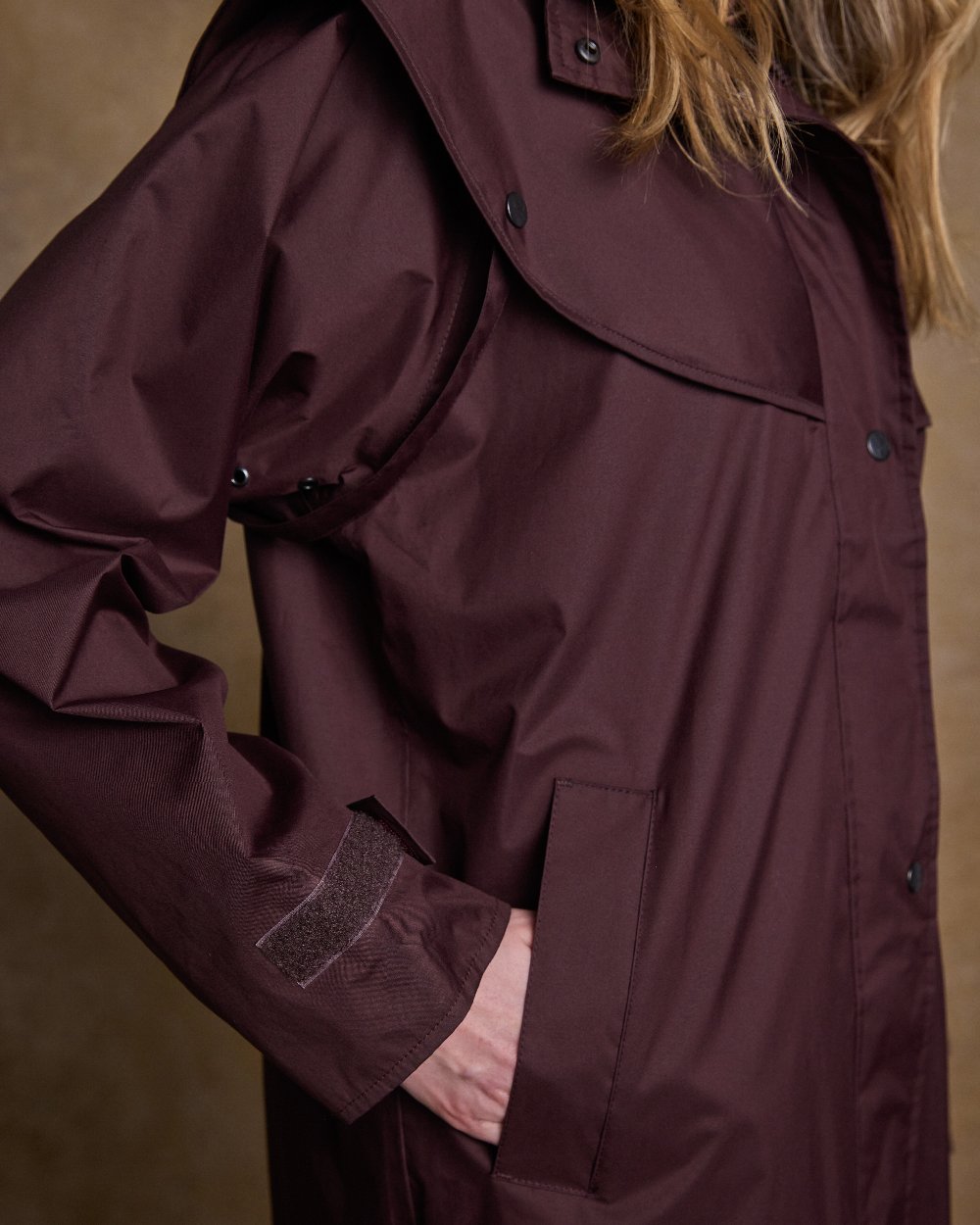 Deep Claret Coloured Jack Murphy Malvern Ladies Waterproof Bush Coat on indoor background