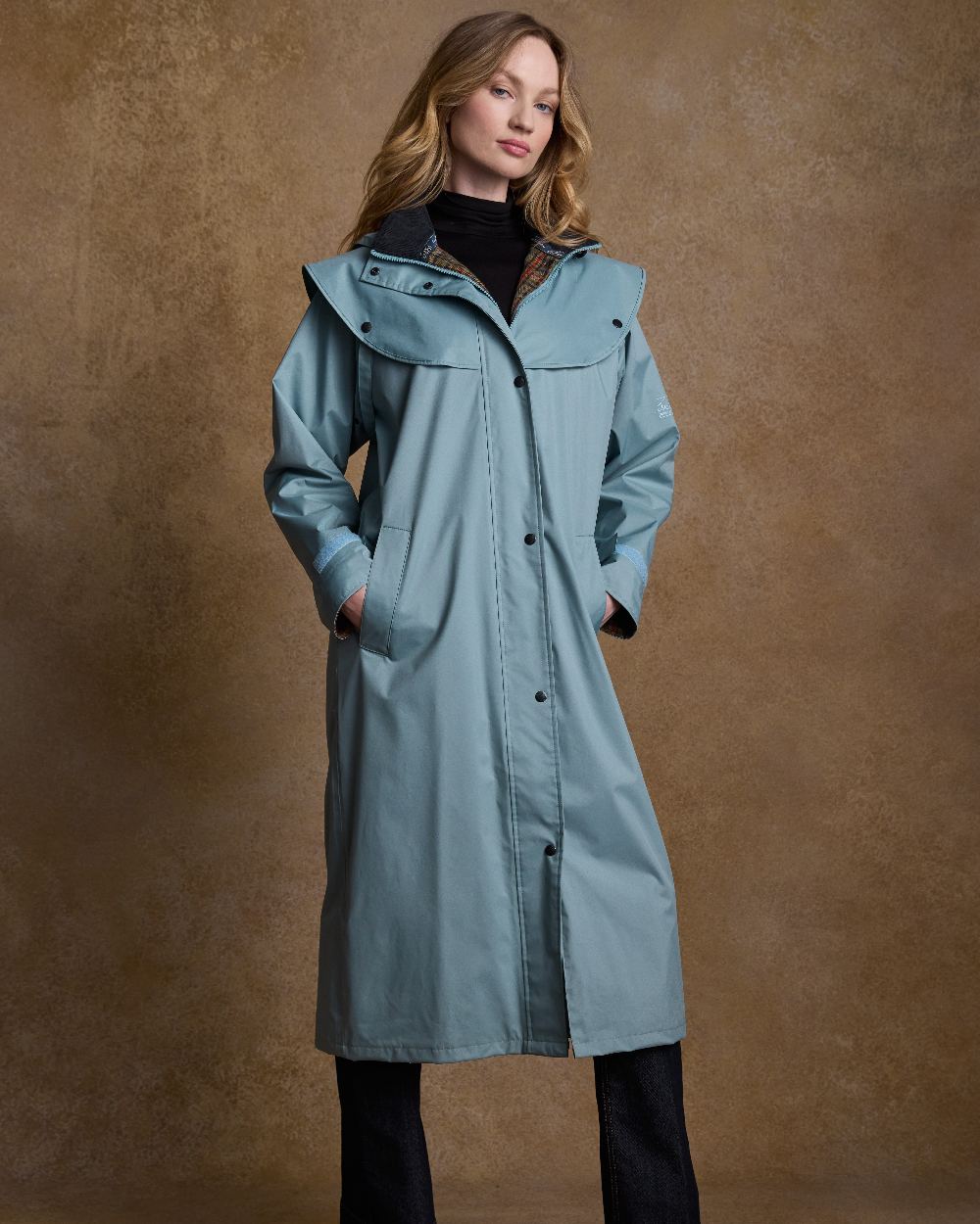 Smokey Blue Coloured Jack Murphy Malvern Ladies Waterproof Bush Coat on indoor background
