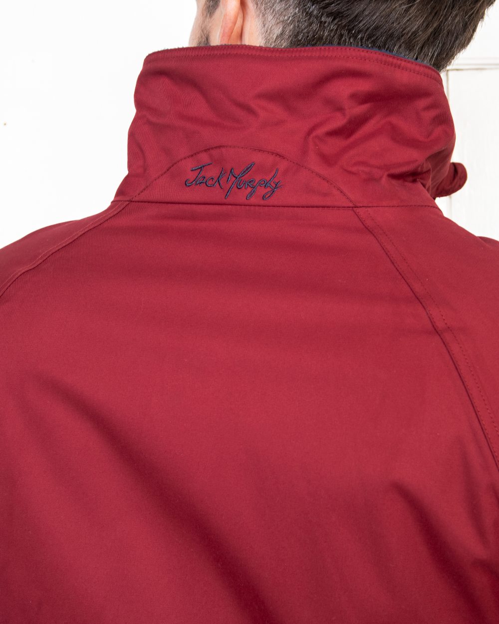 Red Coloured Jack Murphy Mens Rockall Waterproof Jacket on indoor background