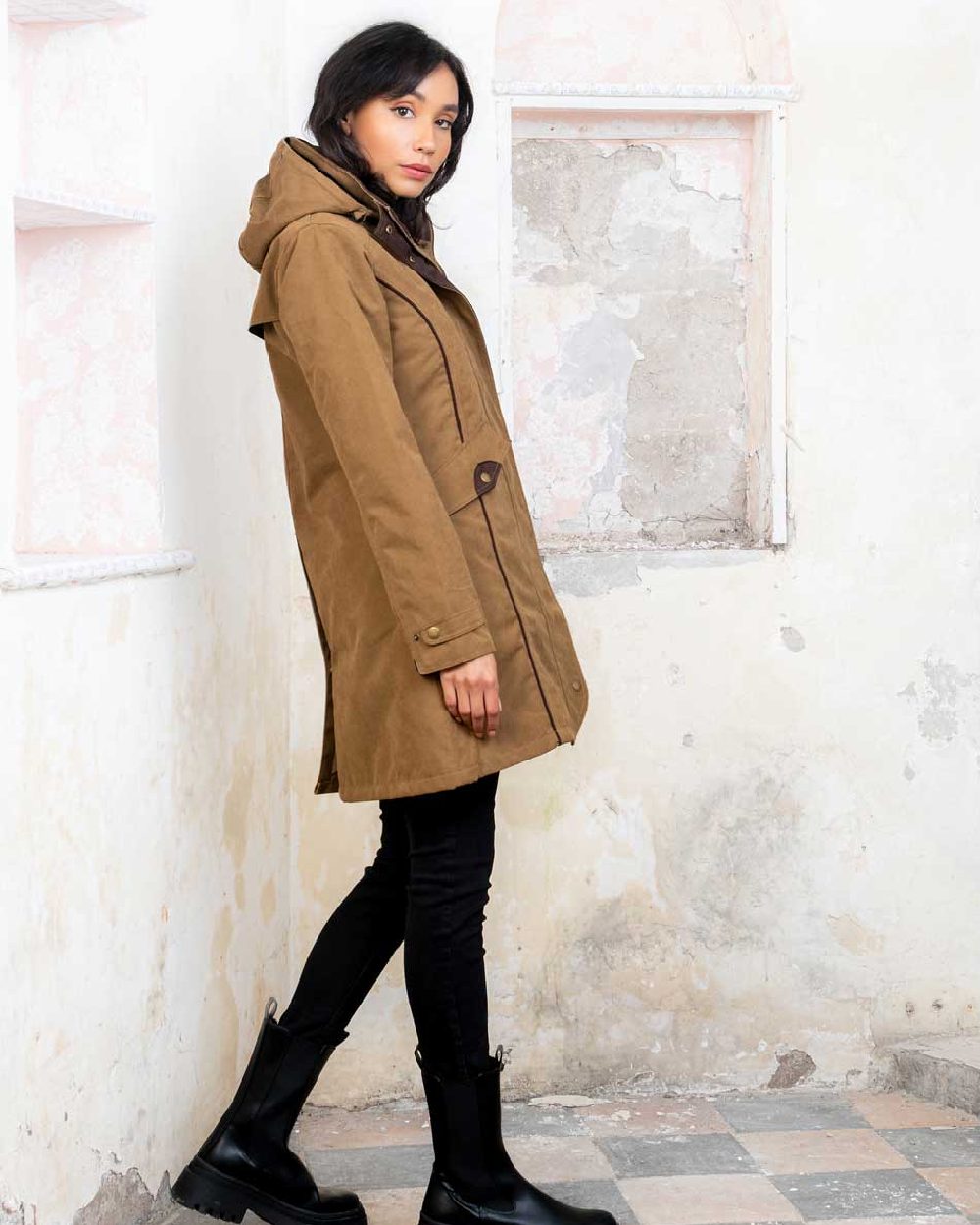 Camel coloured Jack Murphy Una 3/4 Waterproof Coat on wall background