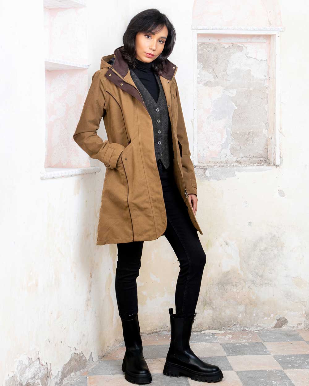 Camel coloured Jack Murphy Una 3/4 Waterproof Coat on wall background