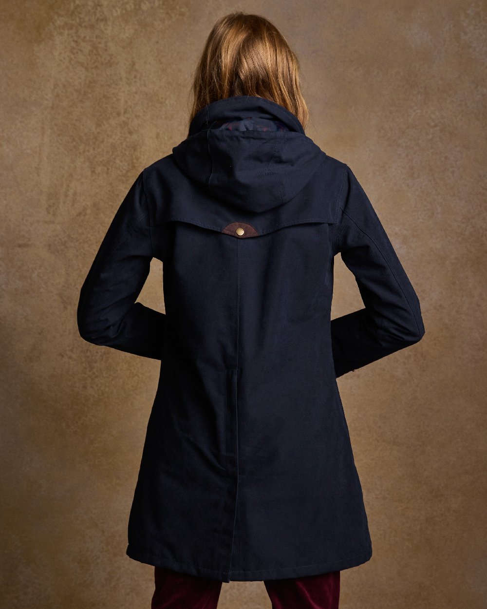 Navy Coloured Jack Murphy Una 3/4 Waterproof Coat on indoor background