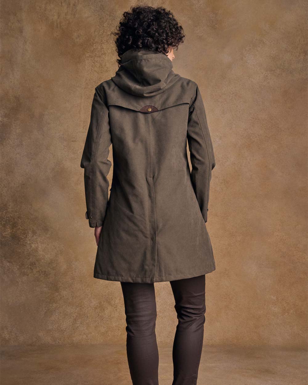 Olive coloured Jack Murphy Una 3/4 Waterproof Coat on wall background