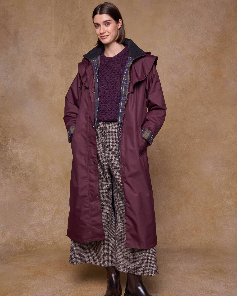 Deep Claret Coloured Jack Murphy Womens Connemara Waterproof Coat on indoor background