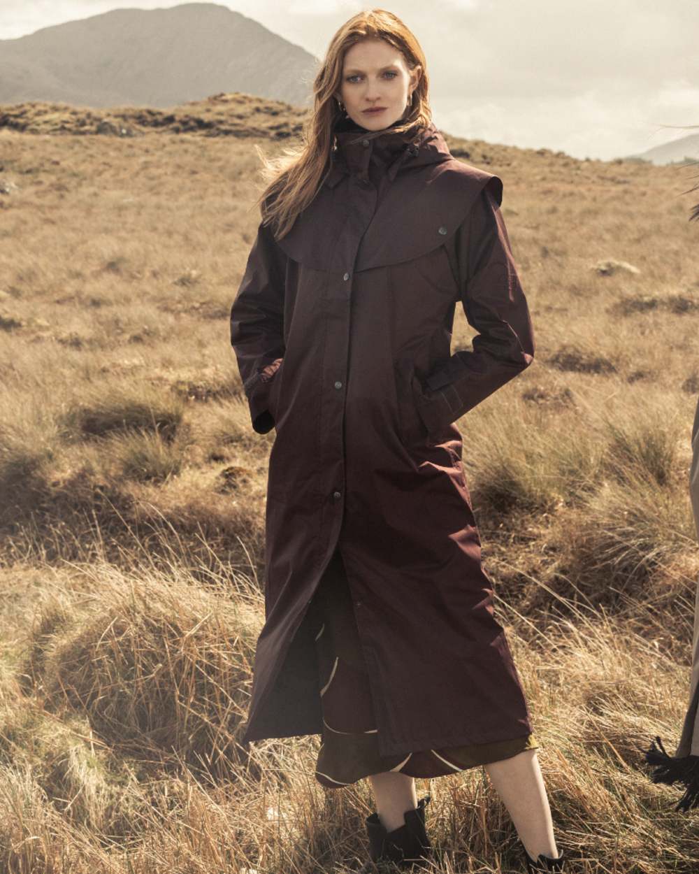 Deep Claret Coloured Jack Murphy Womens Connemara Waterproof Coat on mountain background
