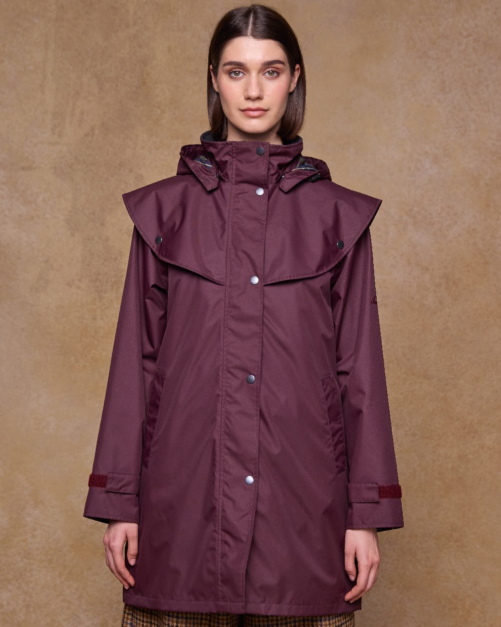 Deep Claret Coloured Jack Murphy Womens Dingle Waterproof Jacket on indoor background