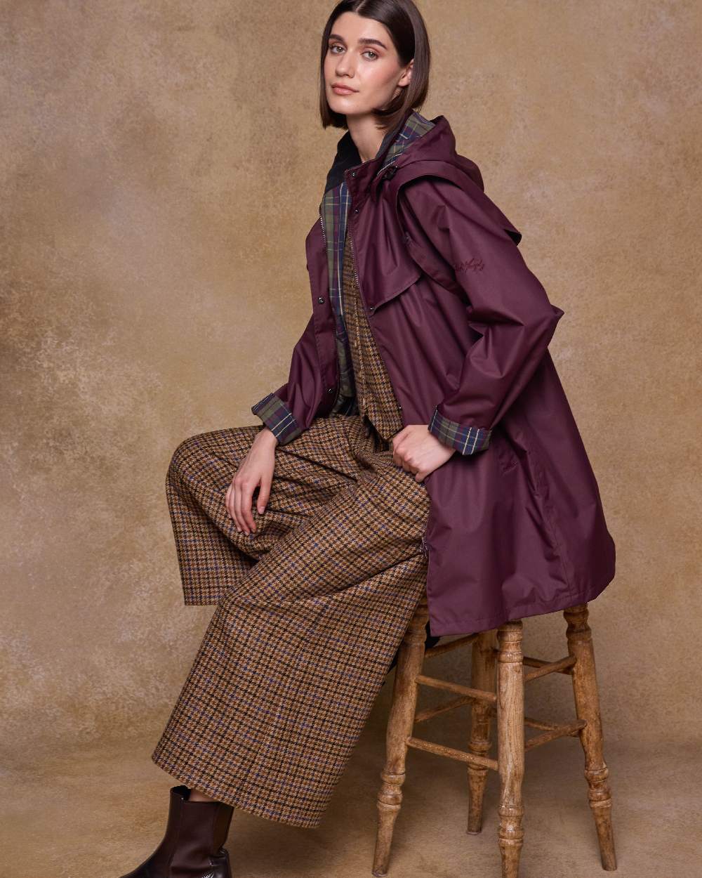 Deep Claret Coloured Jack Murphy Womens Dingle Waterproof Jacket on indoor background