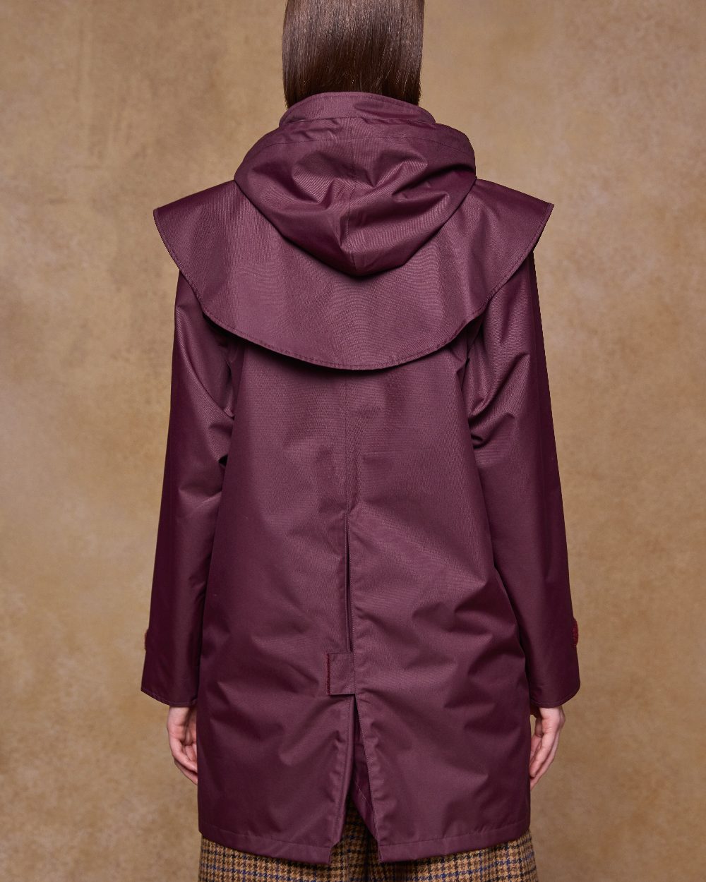 Deep Claret Coloured Jack Murphy Womens Dingle Waterproof Jacket on indoor background