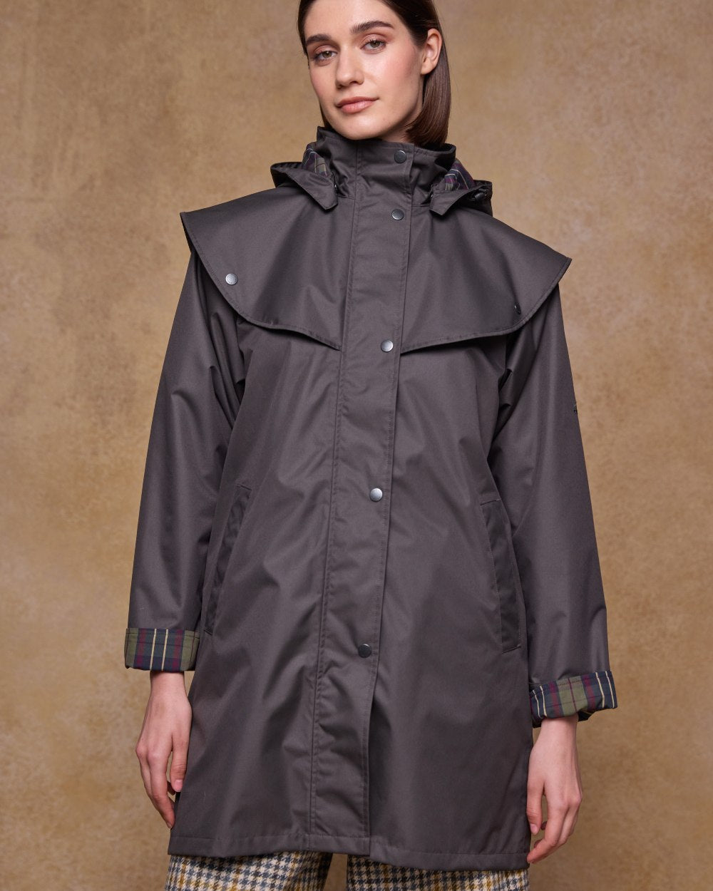 Olive Coloured Jack Murphy Womens Dingle Waterproof Jacket on indoor background