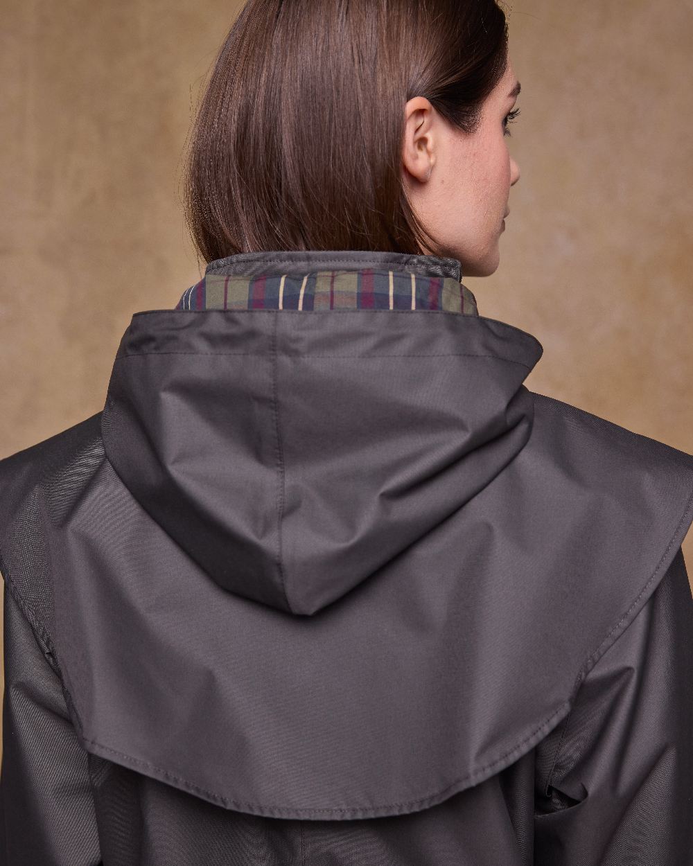 Olive Coloured Jack Murphy Womens Dingle Waterproof Jacket on indoor background