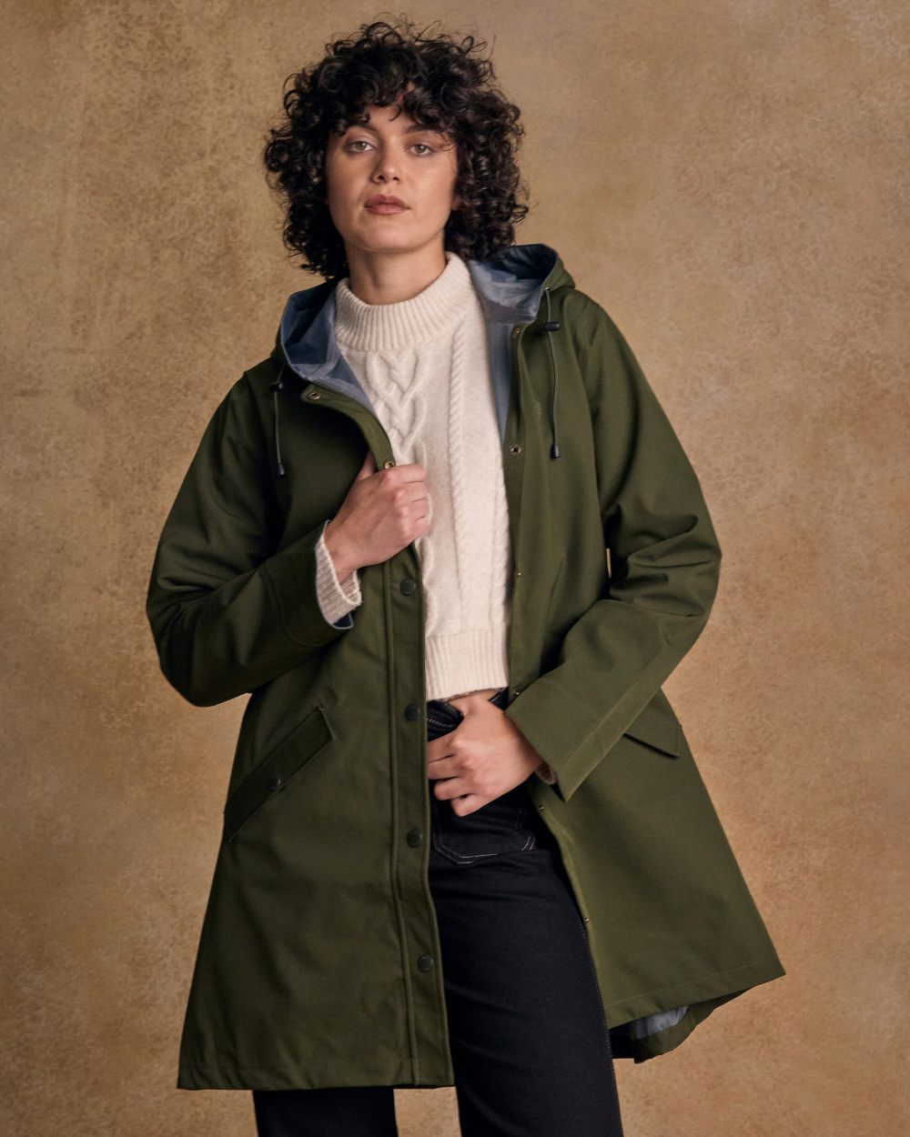 Olive Coloured Jack Murphy Womens Fiadh Waterproof Jacket on indoor background