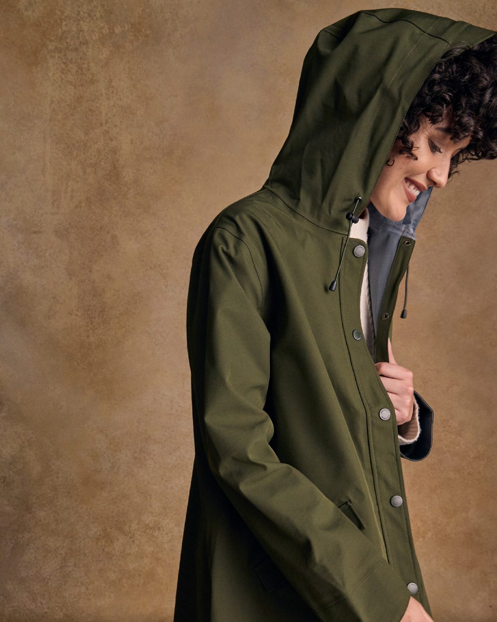 Olive Coloured Jack Murphy Womens Fiadh Waterproof Jacket on indoor background