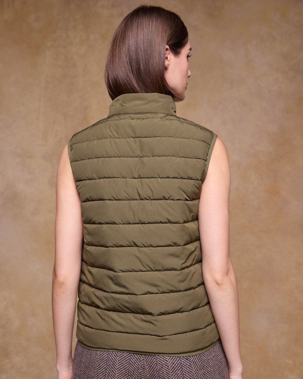 Olive Coloured Jack Murphy Womens Leah Puffa Gilet on indoor background