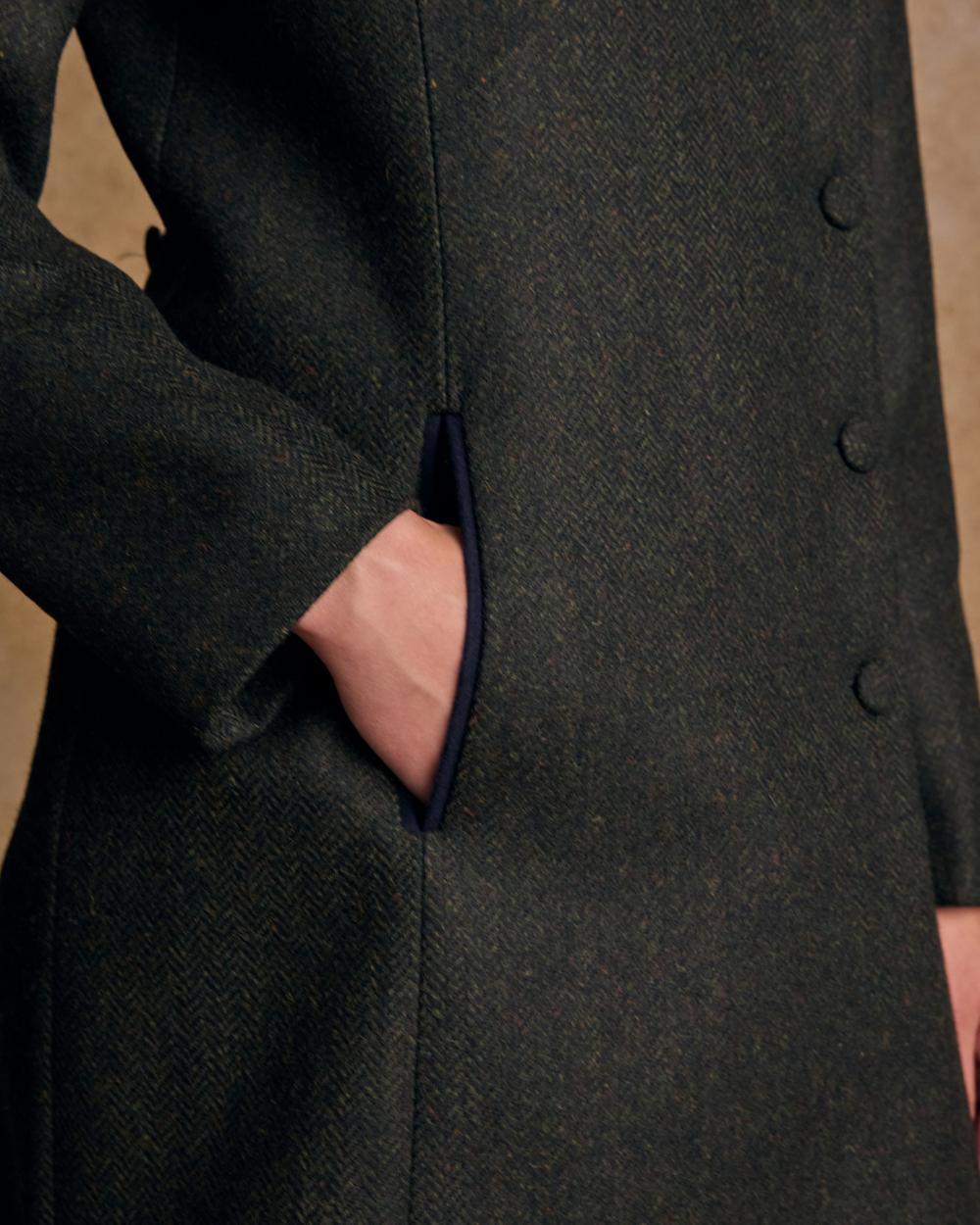 Deep Green Herringbone coloured Jack Murphy Womens Robin Tweed Coat on textured background