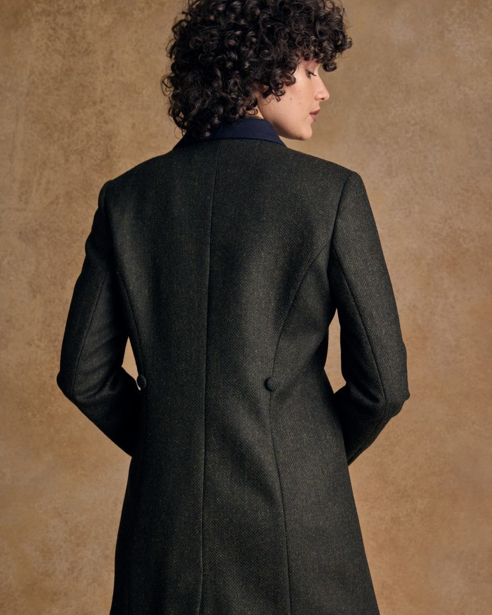 Deep Green Herringbone coloured Jack Murphy Womens Robin Tweed Coat on textured background