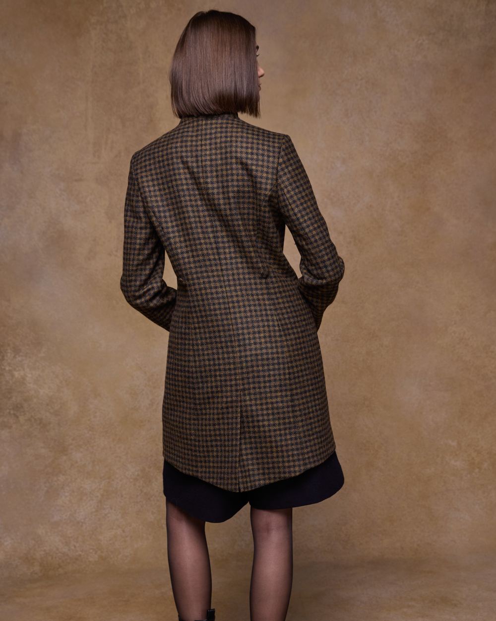 Earth Check coloured Jack Murphy Womens Robin Tweed Coat on textured background