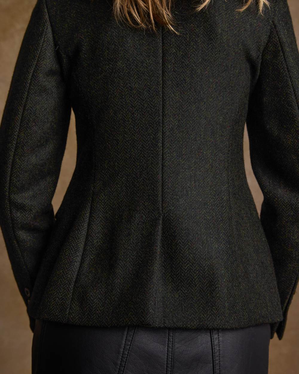 Deep Green Herringbone coloured Jack Murphy Womens Tara Tweed Hacking Jacket on textured