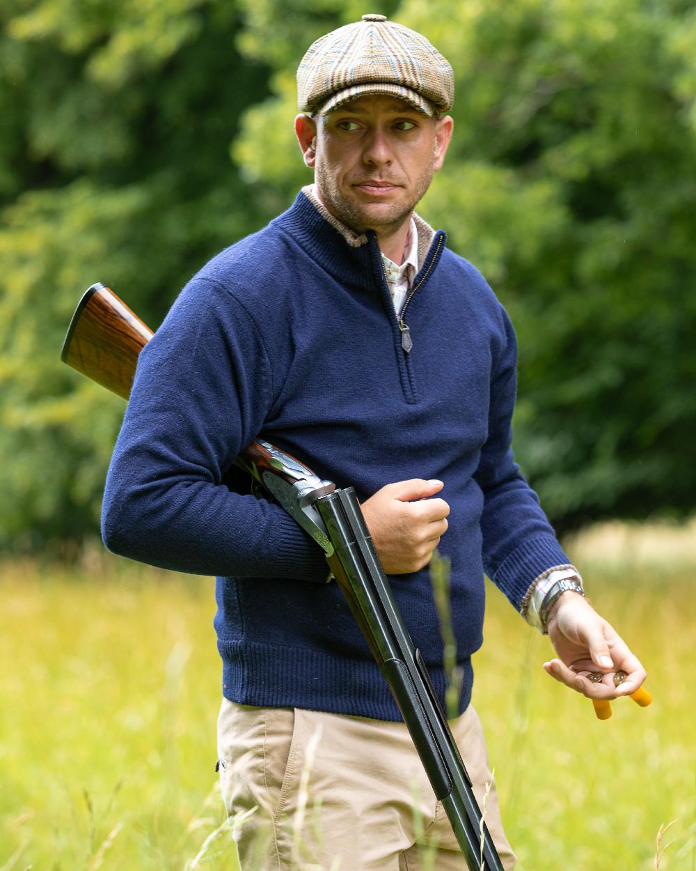 Navy coloured Jack Pyke Ashcombe Lambswool Zip Knit Pullover on forest background