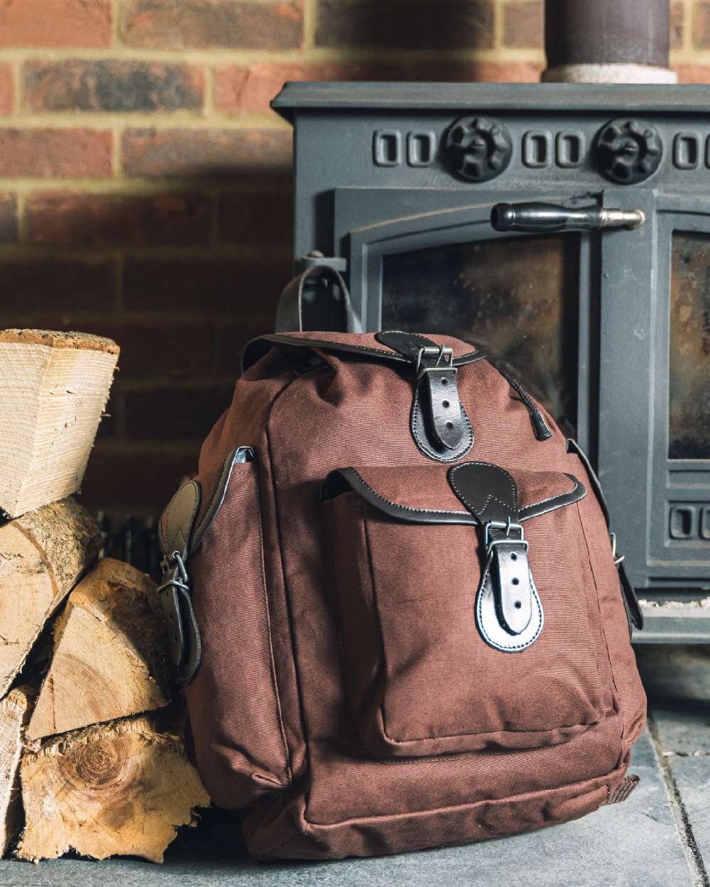 Brown coloured Jack Pyke Canvas Day Pack on wall background