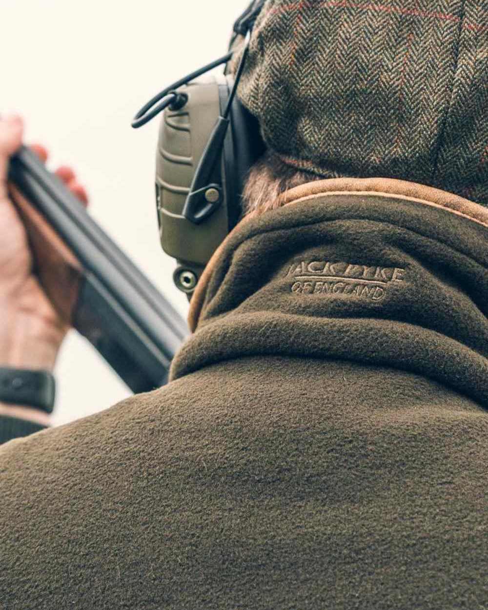 Dark Olive coloured Jack Pyke Countryman Fleece Gilet on sky background
