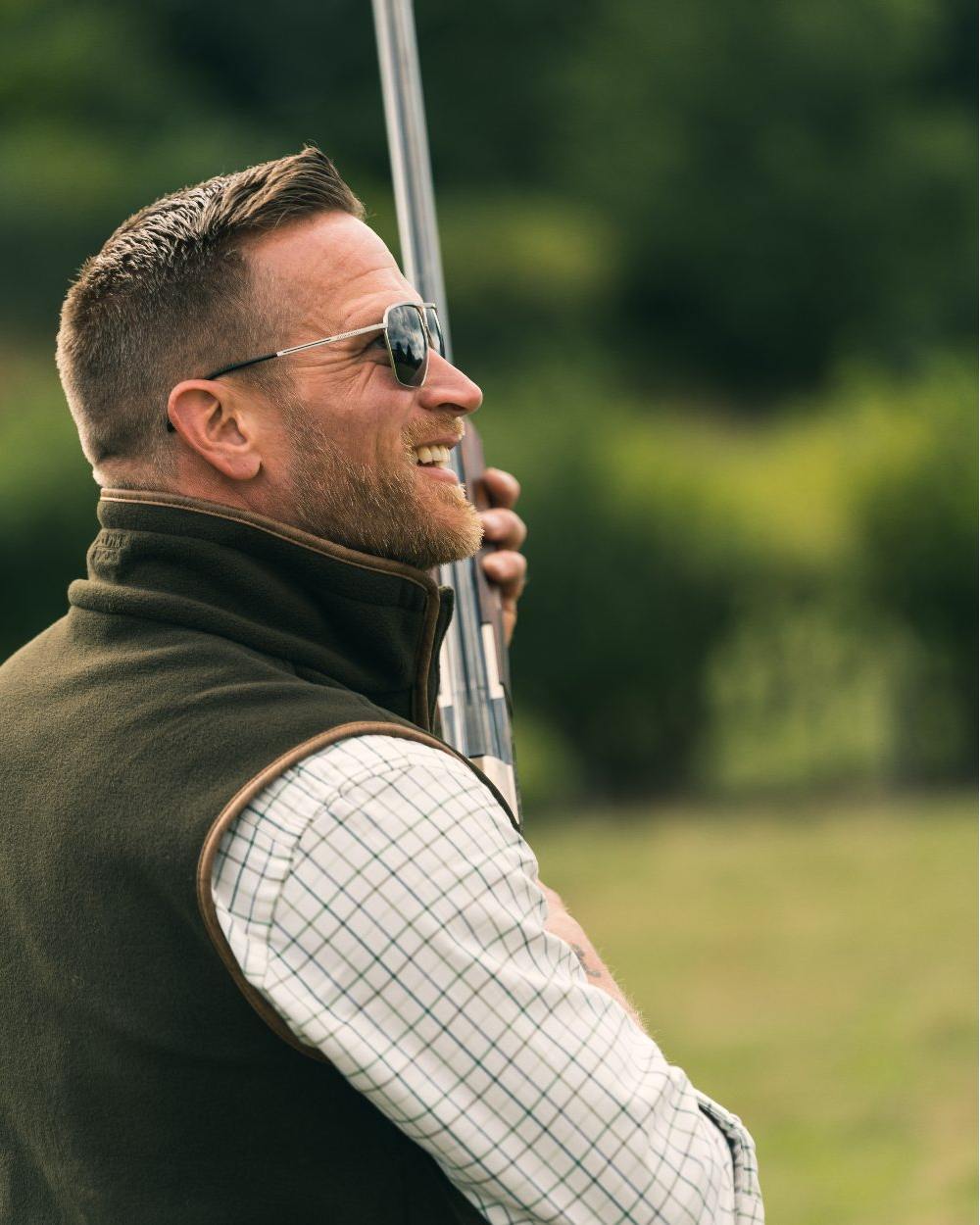 Dark Olive coloured Jack Pyke Countryman Fleece Gilet on blurry background