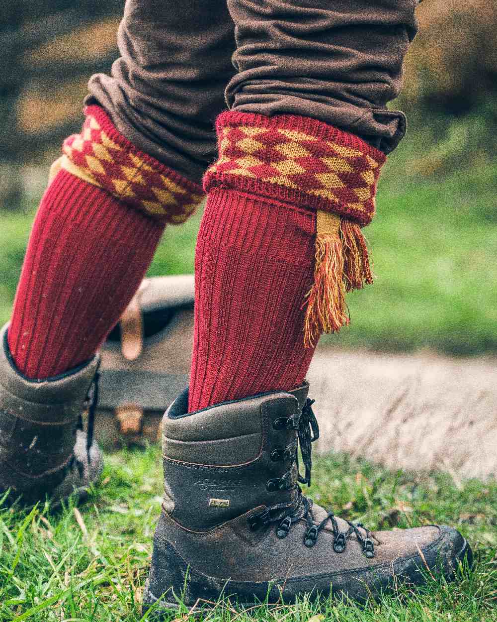 Burgundy Coloured Jack Pyke Harlequin Socks on outdoor background