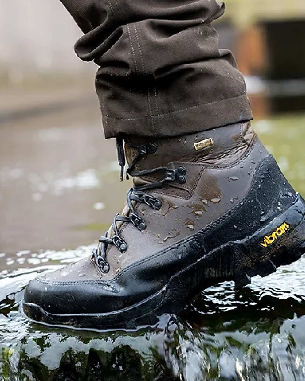 Brown coloured Jack Pyke Hunters Boots on water background