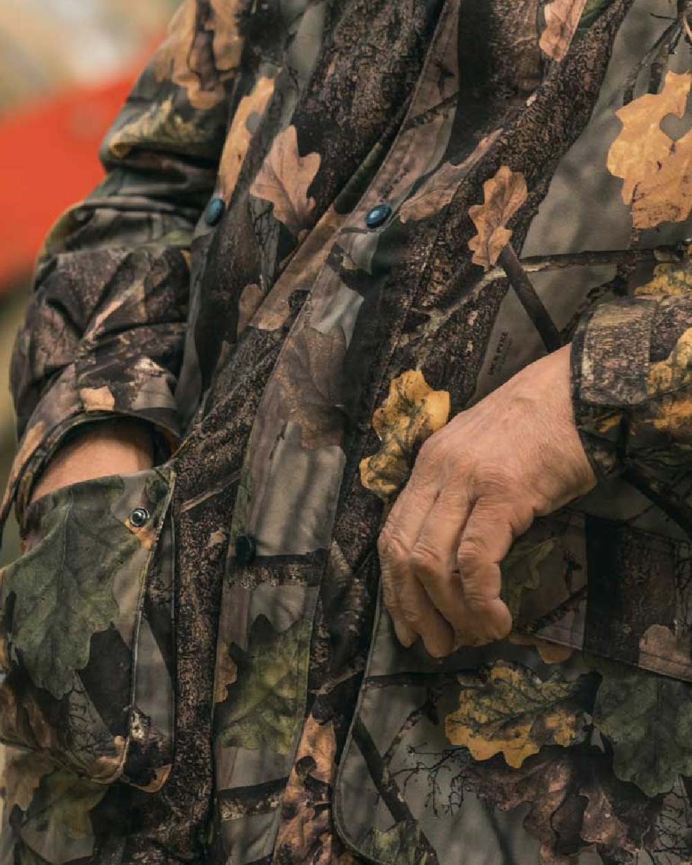 EVO coloured Jack Pyke Hunters Jacket on blurry background