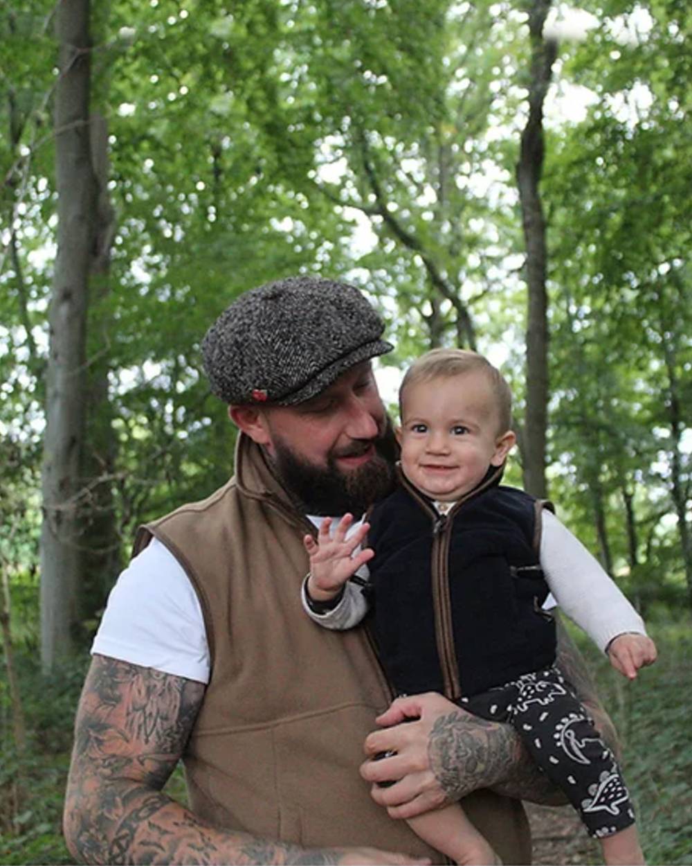Navy coloured Jack Pyke Junior Countryman Gilet on forest background