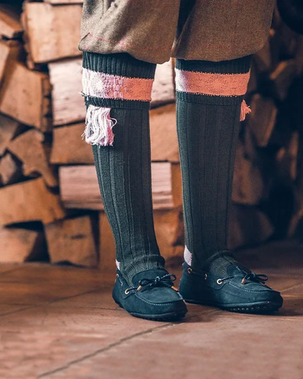 Green Pink coloured Jack Pyke Ladies Shooting Socks on wood background