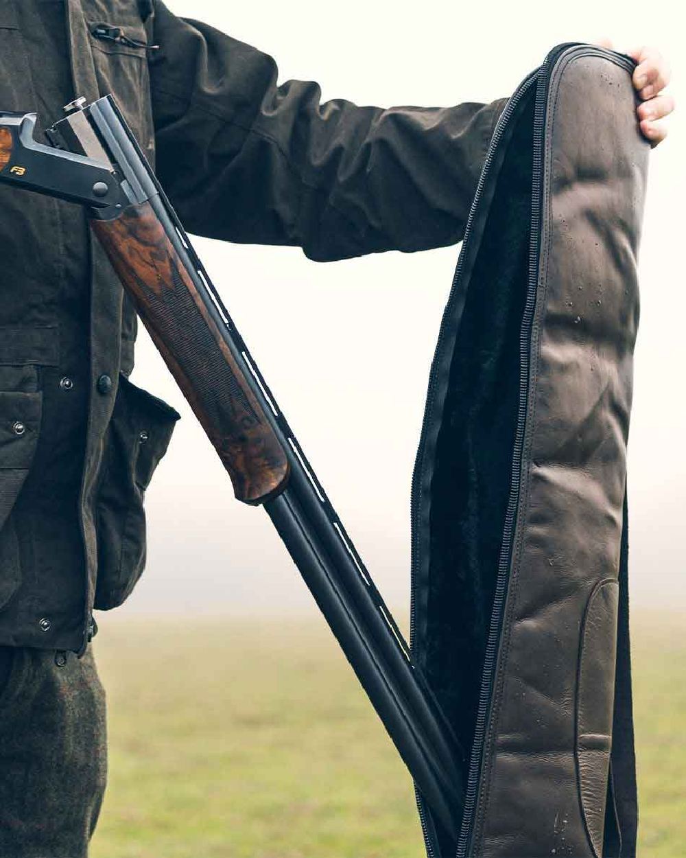 Brown coloured Jack Pyke Leather Shotgun Slip on blurry background